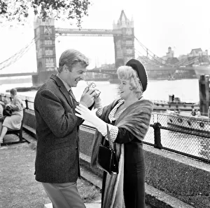 Photographer Prints: Michael Caine and Shelley Winters filming Alfie at the Tower of London