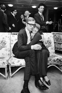 Cigarette Prints: Michael Caine, who stars in the film Alfie poses with Cilla Black
