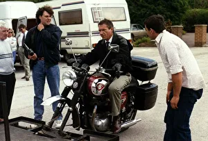 Michael Elphick Actor sitting on a BSA Motor Cycle during the filming of an episode of