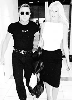 Michael Flatley leaves Heathrow Airport December 1999 with girlfriend Lisa Murphy