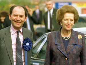 Michael Forsyth MP wearing blue rosette pink shirt patterned tie with Lady Margaret