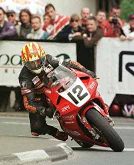 Michael Rutter Racing Driver June 1998 rounding the quater bridge