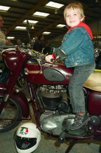 Motorcycles0414 Prints: Michael Tilley, aged three and a half, tries out a 1956 Ariel 500cc at the Classic Bike
