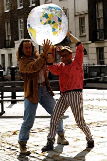 00126 Prints: Michael Van Wijk Entertainer Holding model of world with Timmy Mallet on street Dbase