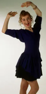 Michelle Watt modelling purple dress November 1989