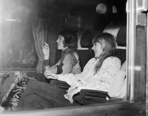 Worship Prints: Mick Jagger and Marianne Faithfull in a carriage leaving Euston Station waiting to leave