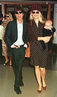 00046 Prints: Mick Jagger pop singer and wife Jerry with their new baby leave Heathrow for Nice