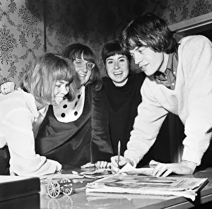 00373 Prints: Mick Jagger of the Rolling Stones seen here with three vacationing dutch fans Tonny