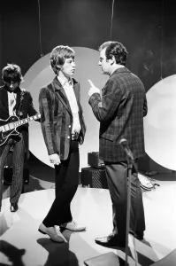 00427 Prints: Mick Jagger talks to the TV director during rehearsals at Teddington for the Eamonn