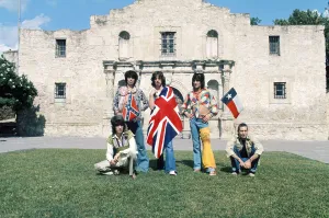 Mick Jagger (with Union Jack flag) and his Rolling Stones band stand at the famous Alamo