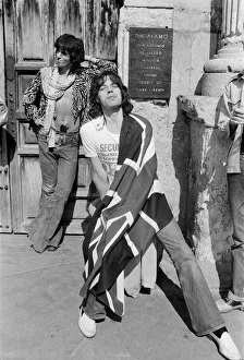 Mick Jagger (with Union Jack flag) and his Rolling Stones band stand at the famous Alamo