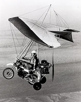 Microlight Aircraft Motorbike. Test pilot Geoff Ball flies