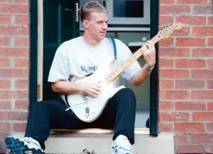 Middlesbrough Prints: Middlesbrough player Robbie Mustoe seen here playing his electric guitar