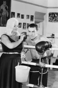 Former Middleweight Champion Alan Minter with singer and Actress Diana Dors at The Thomas