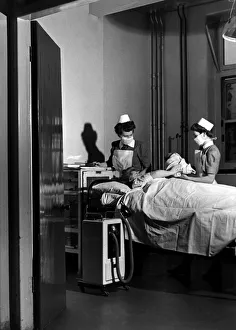 00097 Prints: Midwives deliver a new born baby inside thew Labour ward at the British Hospital for