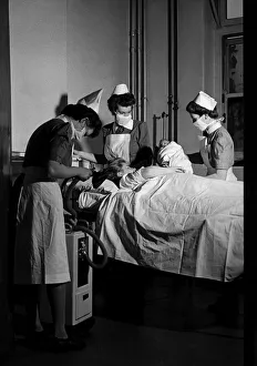 00096 Prints: Midwives deliver a new born baby inside thew Labour ward at the British Hospital for