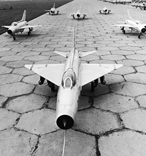Runway Prints: MiG-21PFL (Nato codename Fishbed) fighter bombers seen here at a undisclosed airbase