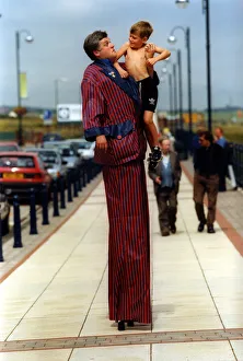 Mike Bridge with Dean Kennedy, 7, on stilts helps relaunch historic Seaham promenade