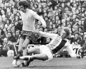 00328 Prints: Mike England of Spurs is challenged for the ball by Bobby Bell of Crystal Palace during
