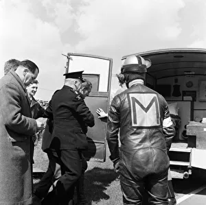 Motorbikes Prints: Mike Halewood, World 500cc Champion is taken from the course after being injured when