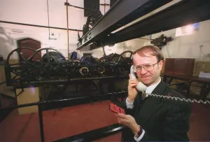 Mike McCann Keeper of the Great Clock December 1999 checks the time - by telephone