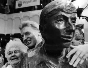 Mike McCartney unveils a life size sculpture of The Beatles at the new Cavern Walks