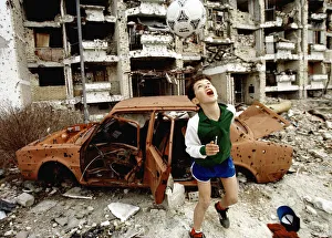 Hope Prints: Mike Moore Award. Feature Photographer of the Year winning photo shows a boy playing in