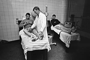 Physio Prints: Mike Summerbee (left) being examined Manchester City players Colin Bell