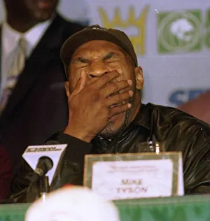 Yawning Prints: Mike Tyson listens to Don Kings speech during the head to head press conference for