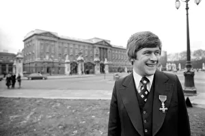 00072 Prints: Mike Yarwood outside Buckingham Palace after receiving the O. B. E. December 1976