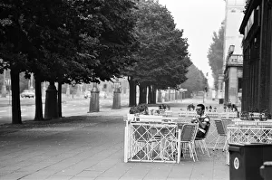 Cafe Prints: One mile from the Berlin Wall, on the East side, one lone person sitting having a drink