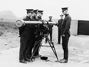 Artillery Prints: Militiamen seen here being given training in the use of an artillery rangefinder at a