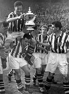 West Brom Prints: Millard, the West Brom Captain holding the FA Cup is chaired by his colleagues round