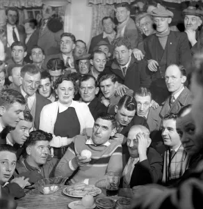 00064 Prints: Miner Joe Steele seen here taking part in a food eating competition