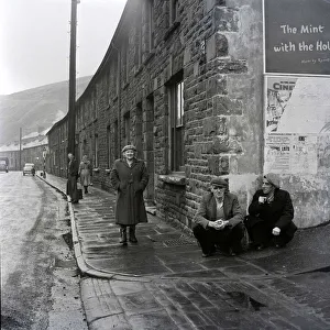 Terrace Prints: Miners from Aberdare in South Wales holding up the wall of the Boot Hotel March