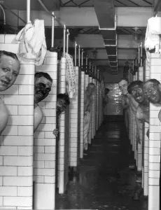 Miners Prints: Miners in the pithead baths following a shift underground at Mosley Common Colliery