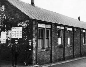 Two miners waiting outside the new social service centre at Burnhope colliery