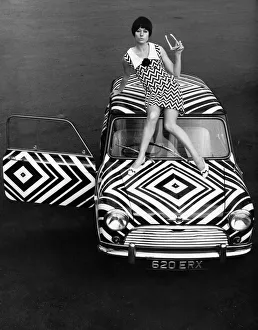 The Mini motorcar that has received the Op-Art treatment from an amateur with a pair of