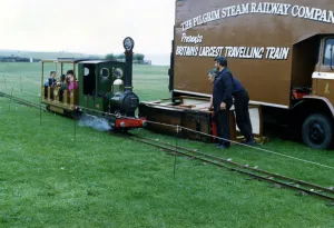 Locomotive Prints: A miniature railway train. belonging to The Pilgrim Steam Railway Company with passengers