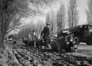 Crops Prints: Miniature tractor ploughs, controlled like motor lawn mowers