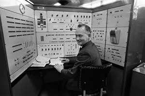 Newcastle Prints: Ministry of Social Security. 41 year old James Newton at the computer which has a file
