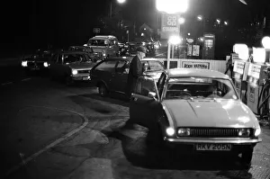Last minute queues for cheap'petrol. Queues more than 100 years long build up
