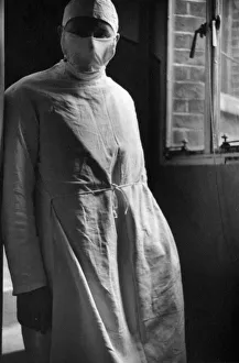 Face Mask Prints: Mirror Cameraman George Greenwell seen here shortly before taking images of a cesarean