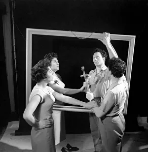 Mirror image: A couple argue in front of a mirror. 1958