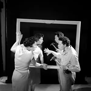 Mirror image: A couple argue in front of a mirror. 1958