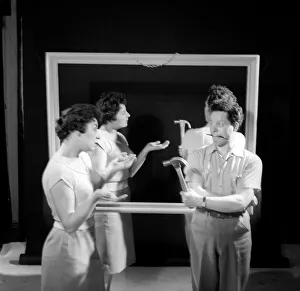 Mirror image: A couple argue in front of a mirror. 1958