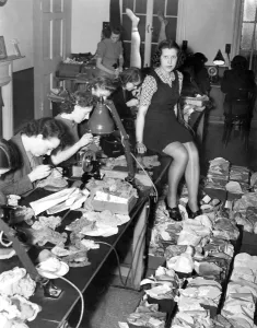 Recycling Prints: Miss 1941 Economises. Silk stocking are becoming extremely expensive