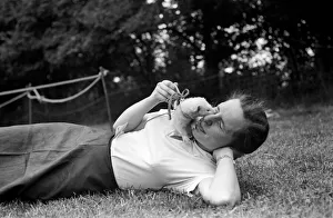 00010 Prints: Miss Ann Jones with her pet ferret. September 1952 C4321-001