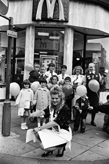 Fundraising Prints: Miss Examiner Andrea Stokes shares a collecting tin outside McDonaldss Huddersfield