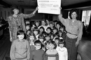 Fundraising Prints: Miss Examiner Madeleine Garbutt (left) is presented with a £1